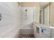 Modern shower with white tiled walls, glass enclosure, and a built-in bench at 887 W Santa Gertrudis Trl, San Tan Valley, AZ 85143