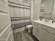 Bathroom featuring a single sink vanity, modern fixtures, and a shower with a striped curtain at 9137 W Sells Dr, Phoenix, AZ 85037