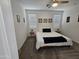 Cozy bedroom featuring a queen bed, neutral decor, and natural light from the windows at 9137 W Sells Dr, Phoenix, AZ 85037