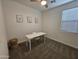 Bedroom with ceiling fan, carpet, and modern decor, featuring a desk, chair and woven baskets at 9137 W Sells Dr, Phoenix, AZ 85037