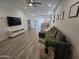 Inviting living room featuring tile floors, recessed lighting, and comfortable seating at 9137 W Sells Dr, Phoenix, AZ 85037