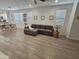 Stylish living room with modern decor, offering a seamless flow to the adjacent dining area and kitchen at 9137 W Sells Dr, Phoenix, AZ 85037