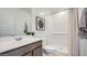 Well-lit bathroom with a single sink, vanity, and a shower-over-tub configuration perfect for modern living at 9530 W Avalon Dr, Phoenix, AZ 85037