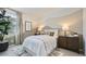 Cozy bedroom featuring a unique two-tone color scheme, stylish rug, and ambient lighting at 9530 W Avalon Dr, Phoenix, AZ 85037