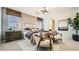 Bright bedroom with modern decor, stylish lighting fixture, and neutral color palette with accent wall at 9530 W Avalon Dr, Phoenix, AZ 85037
