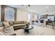 Open-concept living space featuring a modern kitchen with stainless steel appliances and a comfortable living area at 9530 W Avalon Dr, Phoenix, AZ 85037