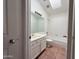 Bright bathroom with natural lighting, a shower-tub combo and neutral tile flooring at 1020 W Sunward Dr, Gilbert, AZ 85233
