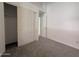 Neutral bedroom featuring a closet with sliding doors and neutral carpet flooring at 1020 W Sunward Dr, Gilbert, AZ 85233