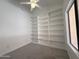 Bedroom with a ceiling fan, built in shelving and natural lighting from a window at 1020 W Sunward Dr, Gilbert, AZ 85233