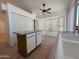 Open kitchen showcasing a center island, tile flooring, a ceiling fan, and a breakfast nook with bay windows at 1020 W Sunward Dr, Gilbert, AZ 85233