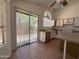 Bright kitchen featuring stainless steel appliances, tile floors, access to patio, and ample counter space at 1020 W Sunward Dr, Gilbert, AZ 85233