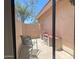 View of a private patio with seating and a small outdoor workbench at 1020 W Sunward Dr, Gilbert, AZ 85233