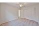 Bright bedroom features neutral carpet, white walls, closet and a ceiling fan at 11626 W Holly St, Avondale, AZ 85392