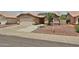 Single Gathering home with desert landscaping, an attached two car garage and a tile roof at 11626 W Holly St, Avondale, AZ 85392