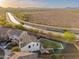 Lovely aerial view showcasing a home's expansive backyard, desert landscape and canal waterway at 12110 W Rowel Rd, Peoria, AZ 85383