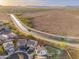 Gorgeous aerial view of a home with canal waterway access and lush surrounding desert landscape at 12110 W Rowel Rd, Peoria, AZ 85383