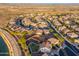 Stunning aerial shot highlighting the property and the surrounding neighborhood, with views of the landscape at 12110 W Rowel Rd, Peoria, AZ 85383