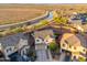 Stunning aerial view showcasing a house and surrounding desert landscape near a tranquil canal waterway at 12110 W Rowel Rd, Peoria, AZ 85383