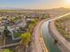 Aerial view of a residential area featuring a canal and desert landscape at 12110 W Rowel Rd, Peoria, AZ 85383