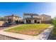 Large backyard featuring a well-maintained lawn, patio, and lush landscaping, perfect for outdoor enjoyment at 12110 W Rowel Rd, Peoria, AZ 85383