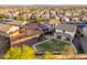 Well-maintained backyard with green lawn, stone patio, and outdoor seating area at 12110 W Rowel Rd, Peoria, AZ 85383