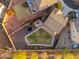 Overhead shot of a spacious backyard with lush landscaping, a patio, a trampoline, and privacy fencing at 12110 W Rowel Rd, Peoria, AZ 85383