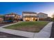 Large backyard with green grass, covered patio, and plenty of space for recreation at 12110 W Rowel Rd, Peoria, AZ 85383