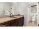 Modern bathroom with a large mirror and vanity at 12110 W Rowel Rd, Peoria, AZ 85383