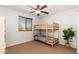 Well-lit bedroom with bunkbeds and a potted plant at 12110 W Rowel Rd, Peoria, AZ 85383