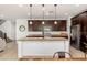 Well-equipped kitchen featuring granite countertops, stainless steel appliances, and modern fixtures at 12110 W Rowel Rd, Peoria, AZ 85383