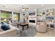 Spacious living room featuring custom built-in shelves and an entertainment center at 12110 W Rowel Rd, Peoria, AZ 85383
