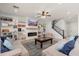 Bright living room features built-in shelving, fireplace, and convenient staircase access at 12110 W Rowel Rd, Peoria, AZ 85383