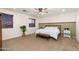 Comfortable bedroom with a plush bed, natural light, and neutral decor at 12110 W Rowel Rd, Peoria, AZ 85383