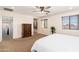 Spacious main bedroom featuring a ceiling fan and large windows at 12110 W Rowel Rd, Peoria, AZ 85383