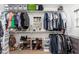 Organized walk-in closet with shelves, hanging rods, and shoe racks at 12110 W Rowel Rd, Peoria, AZ 85383