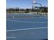 Community basketball court with modern black metal shade structures and seating at 15515 W Deanne Dr, Waddell, AZ 85355