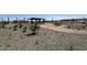 Walking path, cactus garden, picnic tables and seating in a common area at 15515 W Deanne Dr, Waddell, AZ 85355