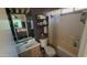 This bathroom has a vanity with a sink, a toilet, and shower with a showerhead at 15729 W Lundberg St, Surprise, AZ 85374