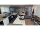 The eat-in kitchen features an island, stainless steel appliances, and ample counter space at 15729 W Lundberg St, Surprise, AZ 85374