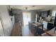 Charming eat-in kitchen featuring a breakfast bar, stainless steel appliances, and ample counter space at 15729 W Lundberg St, Surprise, AZ 85374