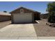 Charming single-story home with a well-maintained front yard and a two-car garage, perfect for a Gathering at 15729 W Lundberg St, Surprise, AZ 85374