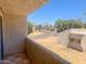 Balcony with a view of a quiet residential street and mature trees at 2155 W Farmdale Ave # 8, Mesa, AZ 85202