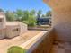 Balcony with a view of neighboring townhomes and lush greenery at 2155 W Farmdale Ave # 8, Mesa, AZ 85202