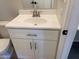 Close-up of bathroom vanity with white countertop, modern hardware, and a brushed nickel faucet at 2155 W Farmdale Ave # 8, Mesa, AZ 85202