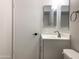 Clean bathroom with white vanity, modern fixtures, and gray flooring at 2155 W Farmdale Ave # 8, Mesa, AZ 85202