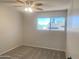 Bedroom with neutral walls, plush carpet, and a window offering bright natural light at 2155 W Farmdale Ave # 8, Mesa, AZ 85202
