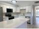 Quartz countertop, stainless appliances, updated kitchen with breakfast bar at 2155 W Farmdale Ave # 8, Mesa, AZ 85202