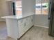 Quartz countertop, stainless appliances, updated kitchen with breakfast bar at 2155 W Farmdale Ave # 8, Mesa, AZ 85202