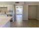 Bright kitchen with white cabinets, stainless steel appliances, and wood-look tile flooring at 2155 W Farmdale Ave # 8, Mesa, AZ 85202