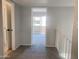 Upstairs landing leading to a bedroom with a sliding door to the balcony at 2155 W Farmdale Ave # 8, Mesa, AZ 85202
